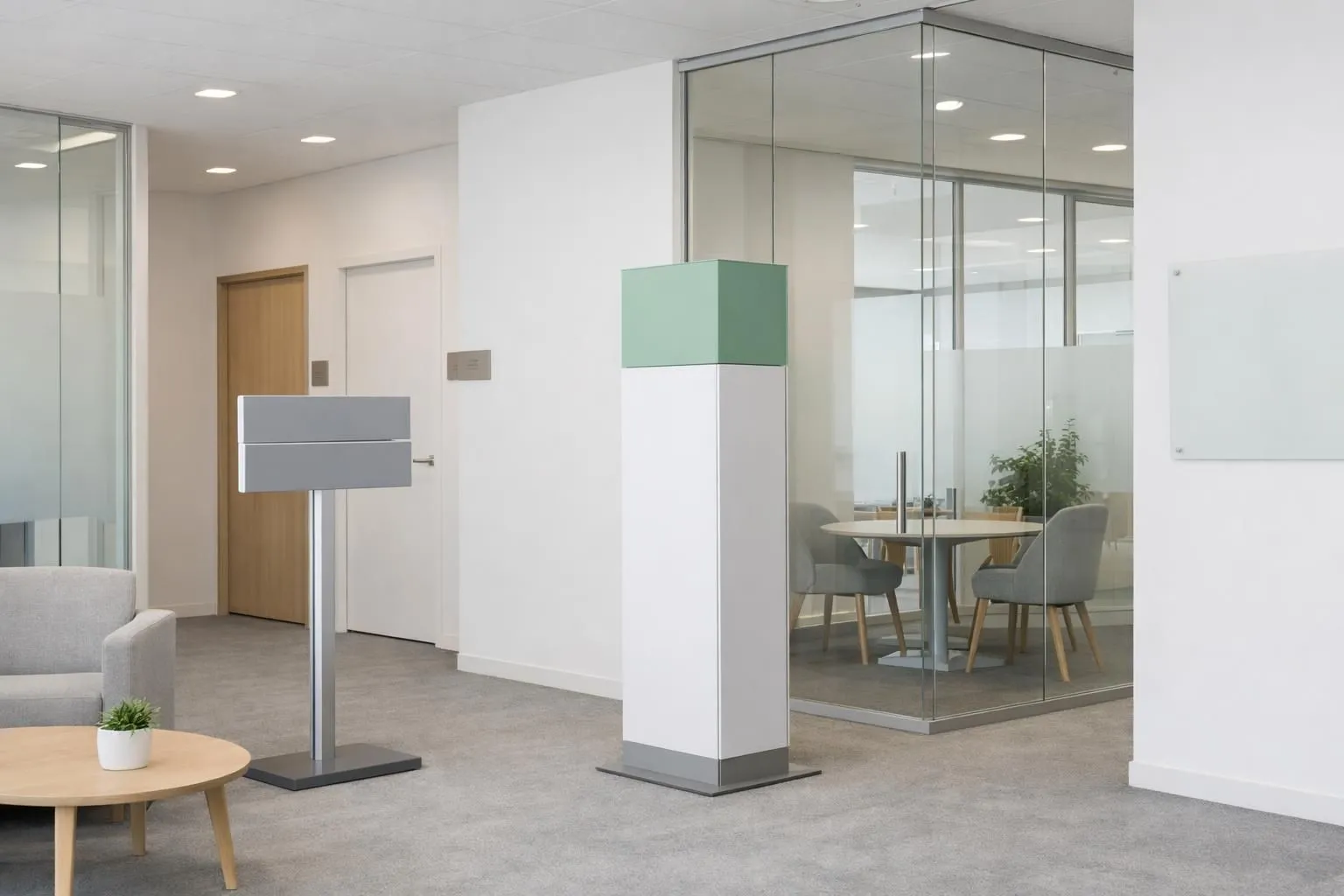 Interior view of modern Swiss corporate office showing professional wayfinding signage, branded glass partitions with frosted designs, freestanding display totems, and door plaques in clean minimalist style without any visible text or letters