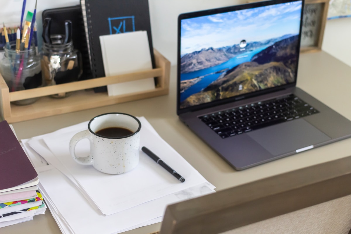 white ceramic mug on white table