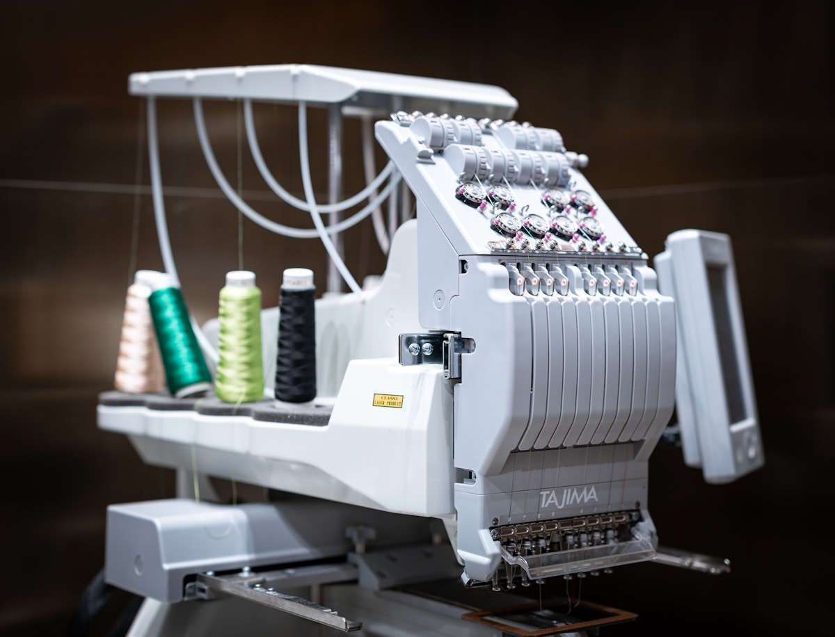 A close up of a machine with some thread on it