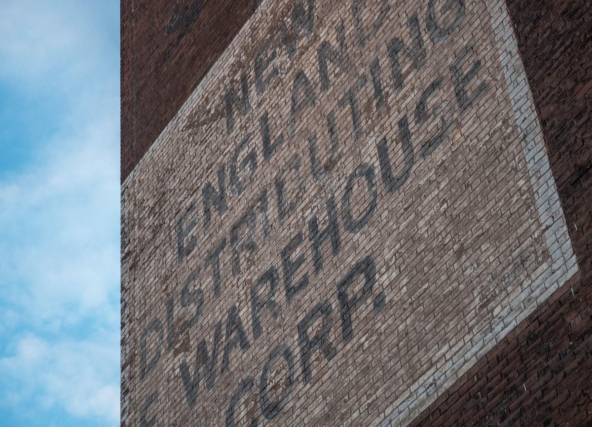 a brick building with a sign on the side of it