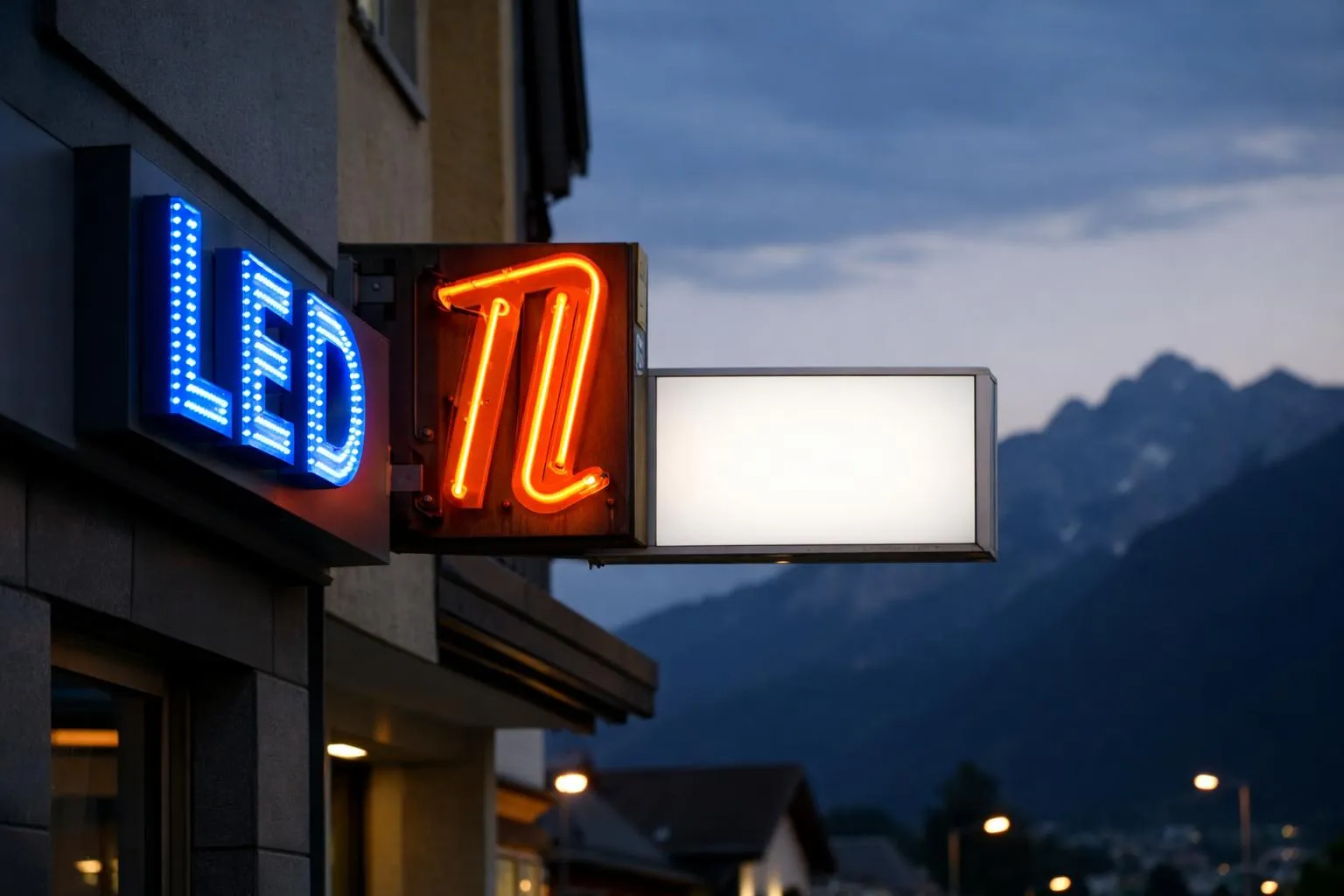 Close-up comparison of three illuminated business signs mounted on building facades showing different lighting technologies: modern LED letters with clean blue glow, traditional neon tube signage with warm orange vintage aesthetic, and backlit lightbox sign with even white illumination, photographed at dusk in urban Swiss commercial district with mountain silhouette in background